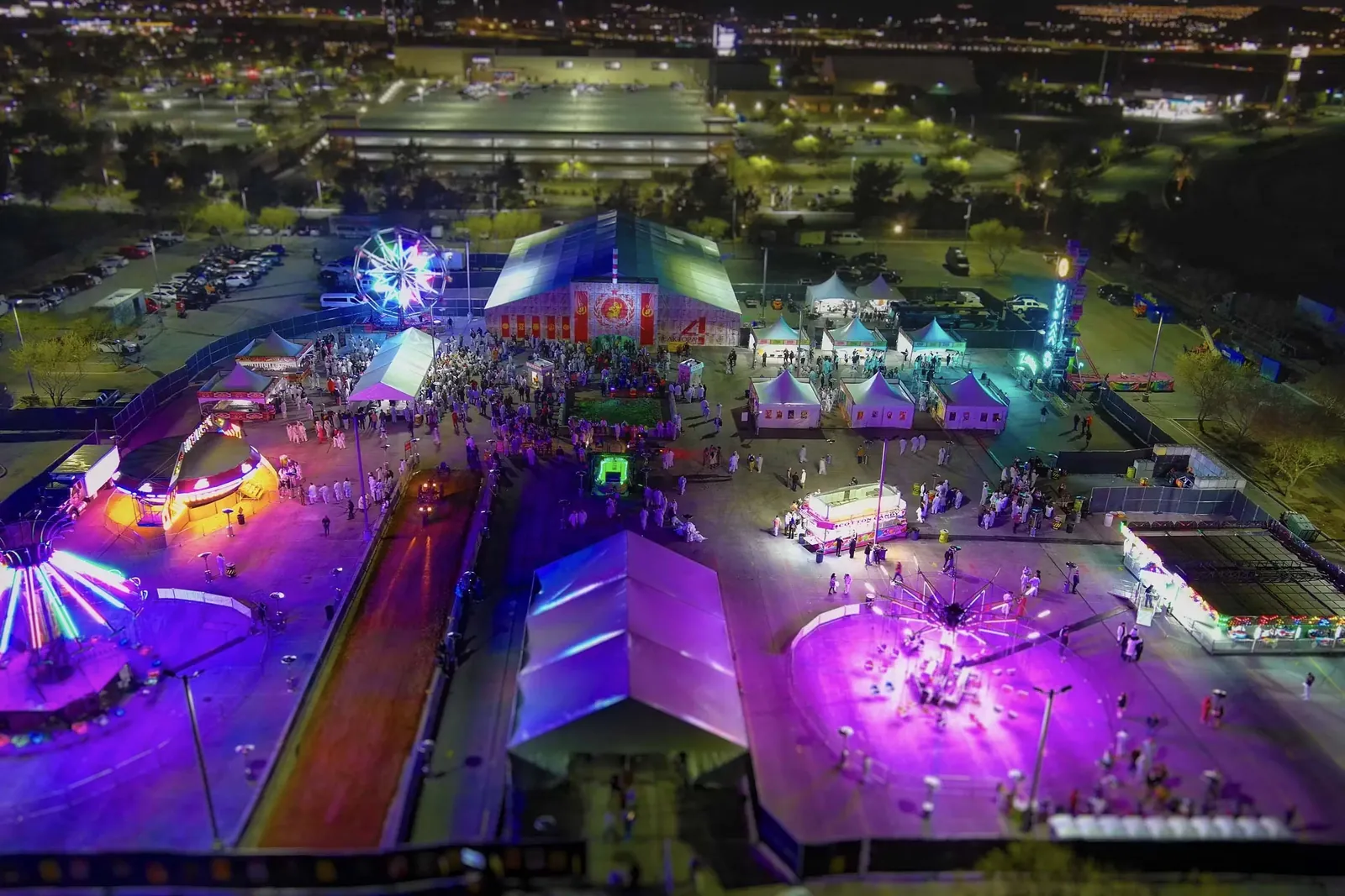 Carnival midway lit up at night at a Las Vegas event