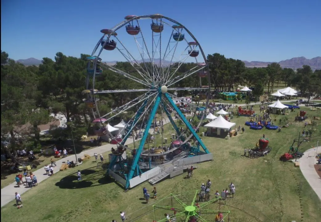 Aerial view ferris wheel carnival fairground white tents outdoor for rent in Las Vegas