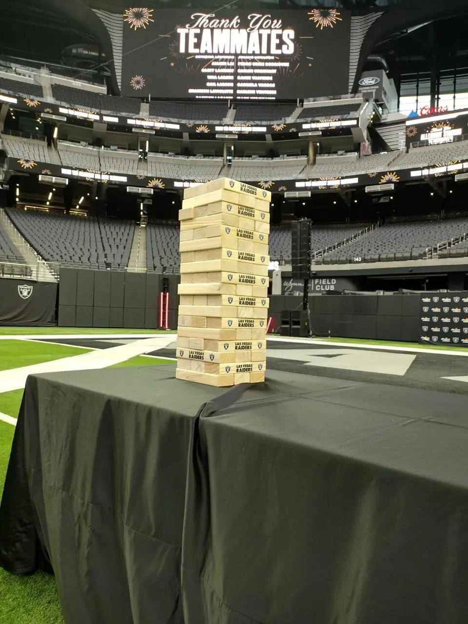 Raiders branded giant jenga game allegiant stadium thank you teammates for rent in Las Vegas