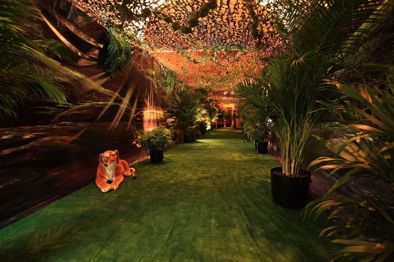 Artificial turf pathway through a jungle themed event