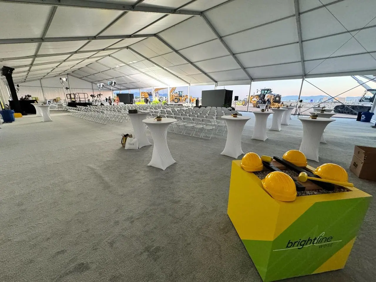 Brightline groundbreaking ceremony tent grey carpet white chairs for rent in Las Vegas