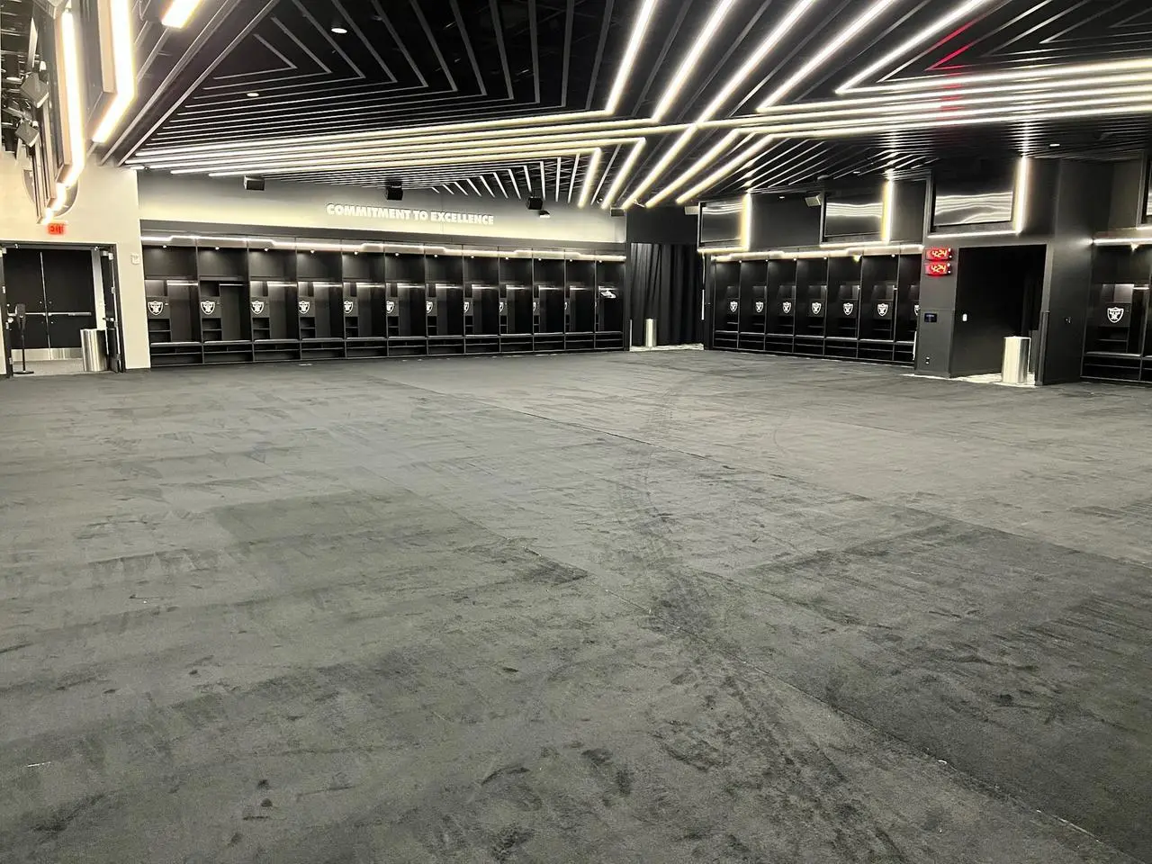 Carpet installation in the Raiders locker room