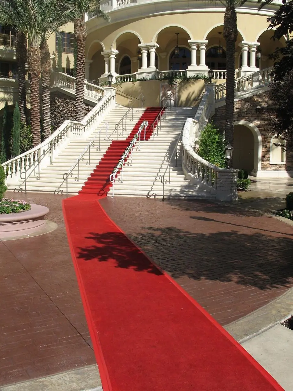 Red carpet running up a resort hotel grand staircase