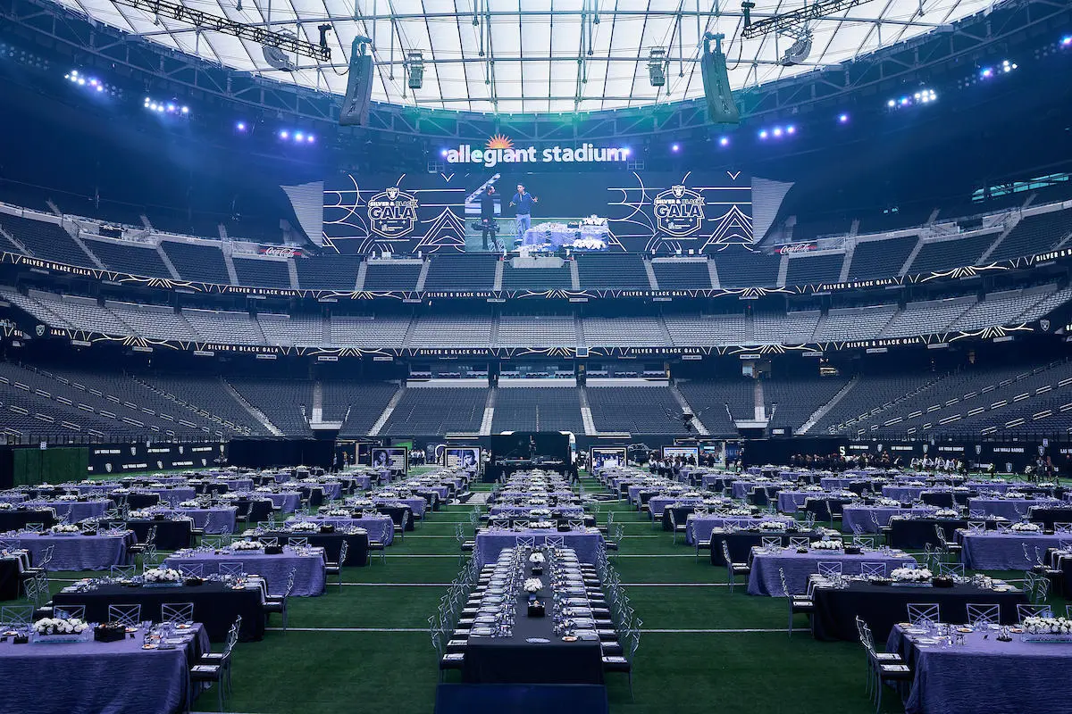Allegiant stadium silver black gala purple tables formal dining for rent in Las Vegas