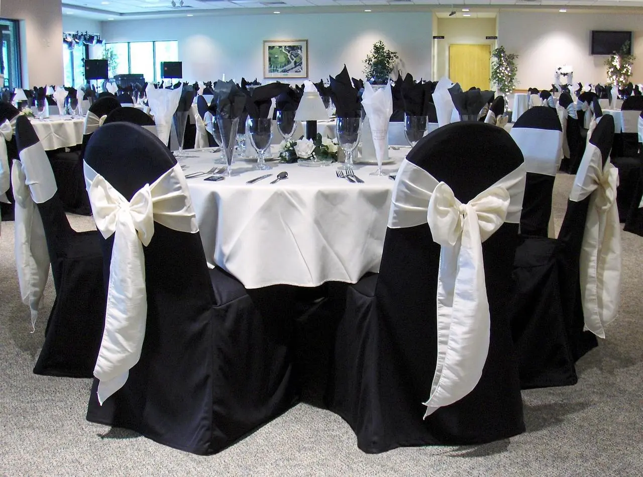 Formal banquet black chairs white sashes elegant dining for rent in Las Vegas