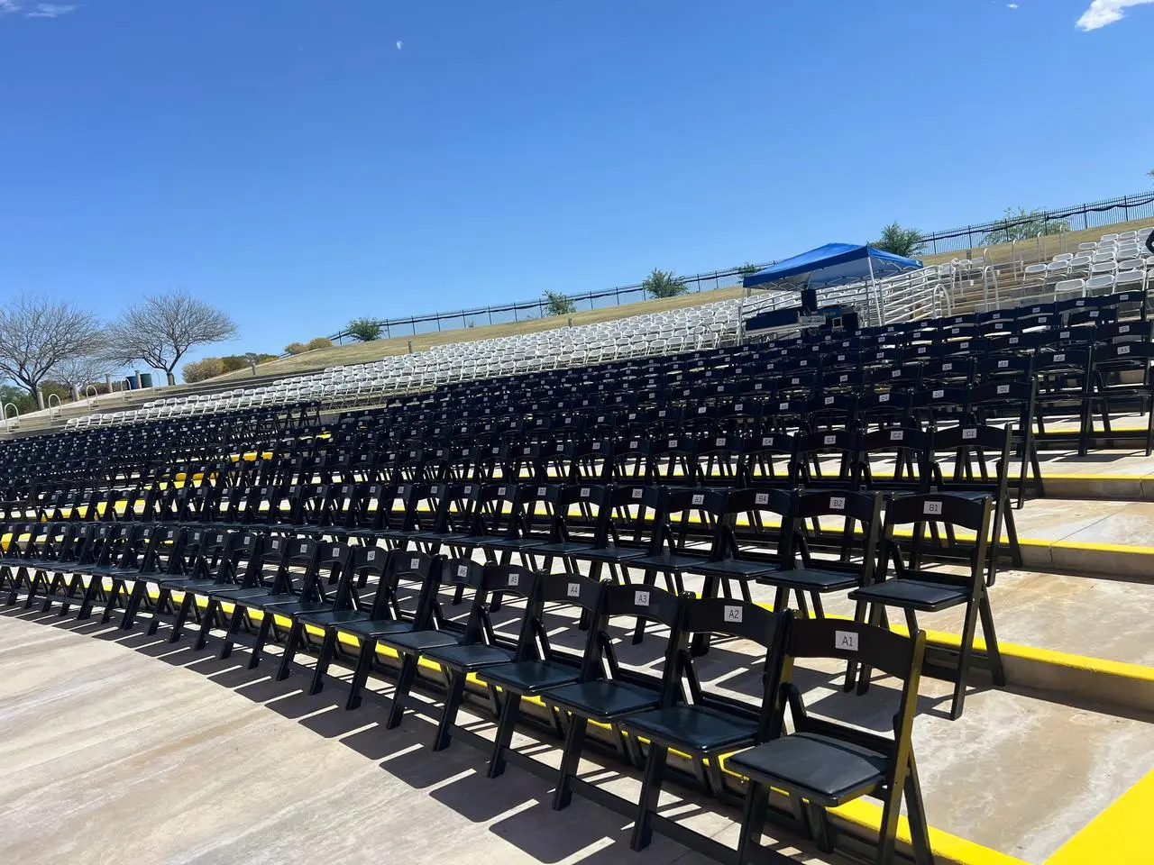 Outdoor amphitheater black folding chairs seating for rent in Las Vegas
