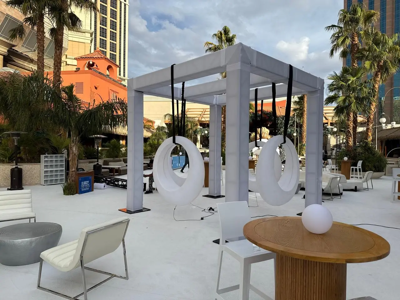Outdoor white canopy moon swings modern lounge furniture for rent in Las Vegas