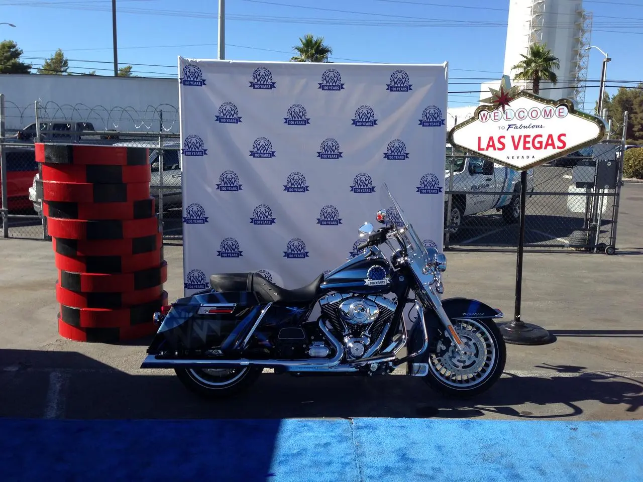 Step and repeat backdrop with branded logos on a red carpet