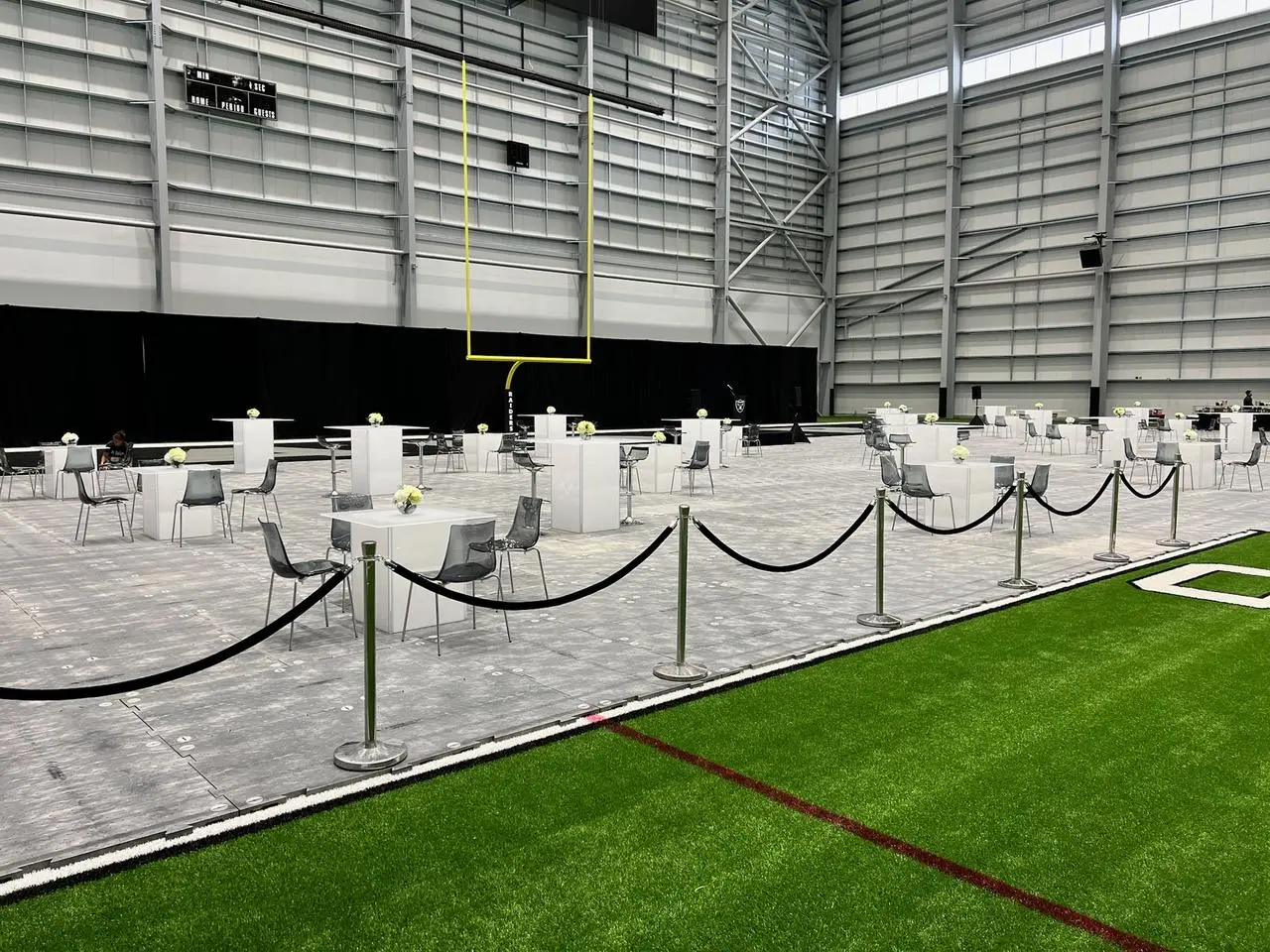 Las vegas raiders indoor facility event tables chairs temporary flooring for rent in Las Vegas