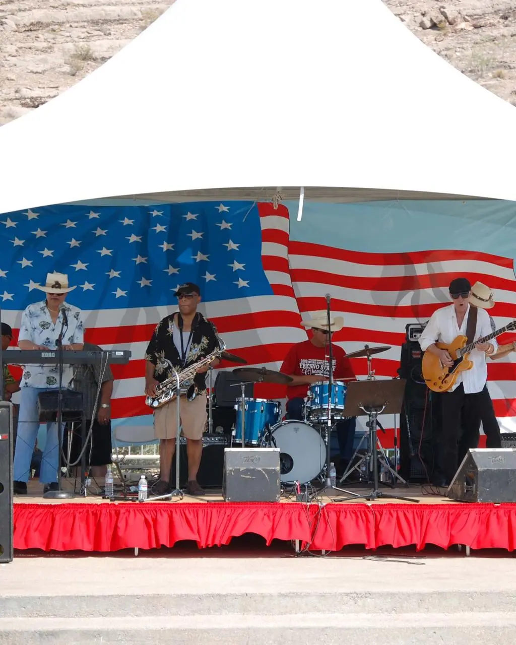 Live band performance outdoor tent american flag backdrop for rent in Las Vegas
