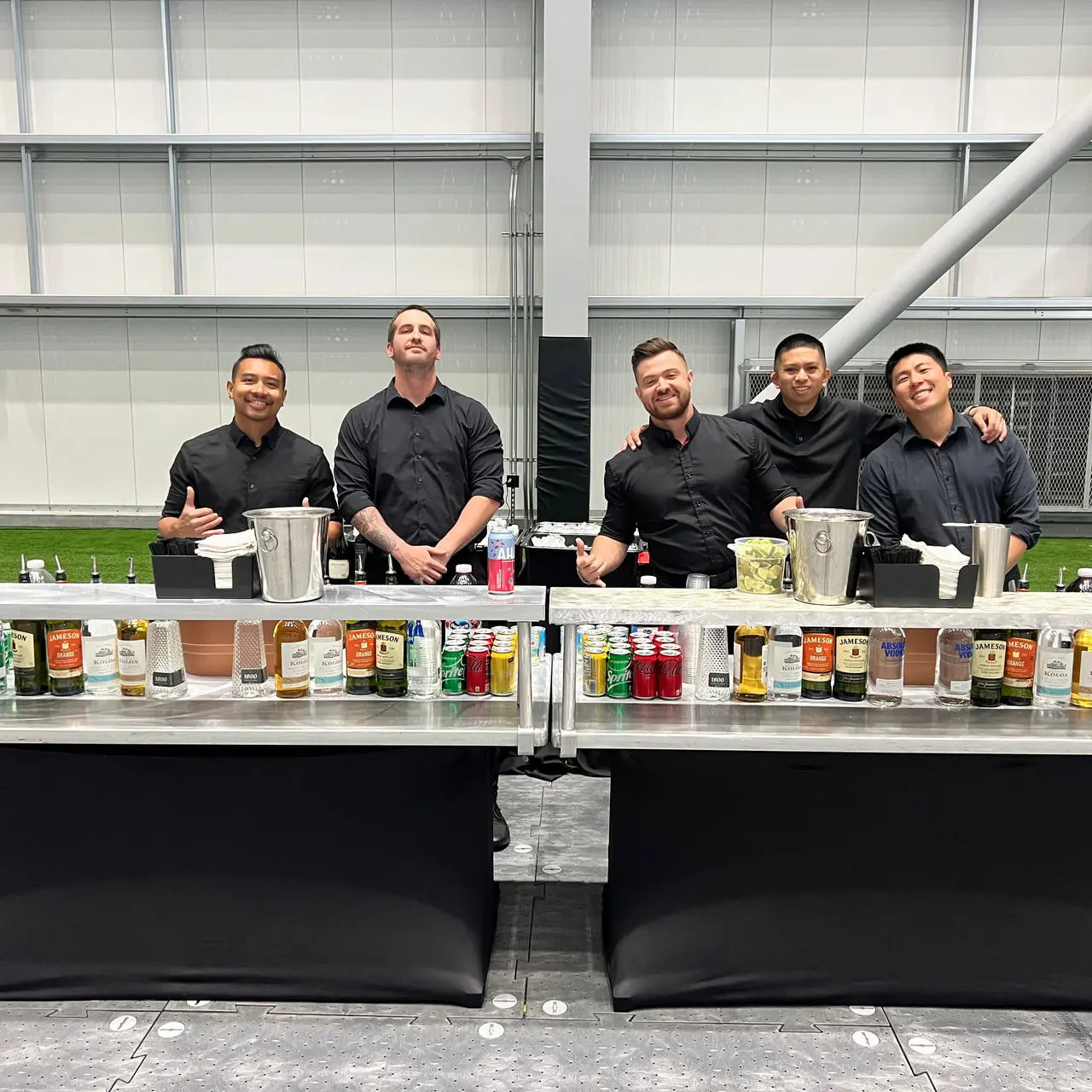 Professional bartenders working mobile bar stations at a Las Vegas event