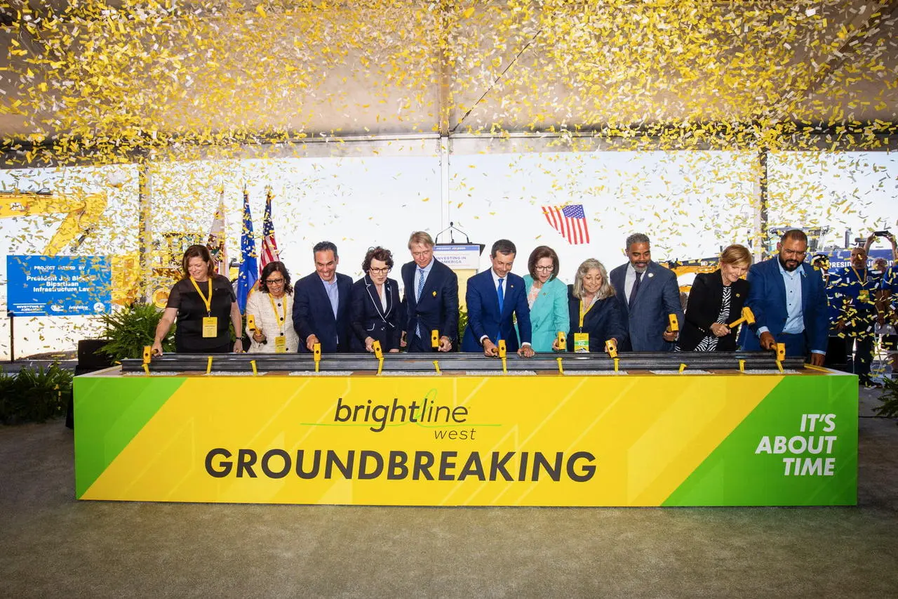 Officials with golden shovels and confetti at the Brightline West groundbreaking ceremony