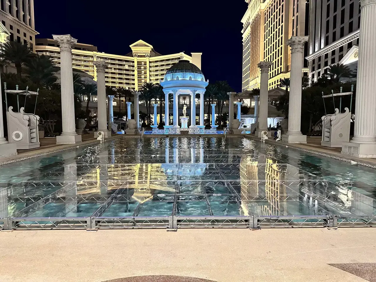 Clear plexiglass stage installed over water at a Las Vegas pool