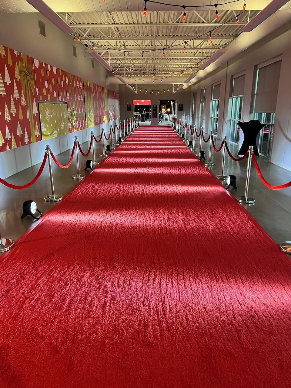 Red carpet chrome stanchions red velvet ropes festive entrance for rent in Las Vegas