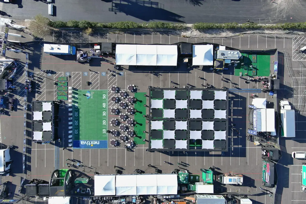 Aerial view large outdoor event checkerboard football field nextiva for rent in Las Vegas