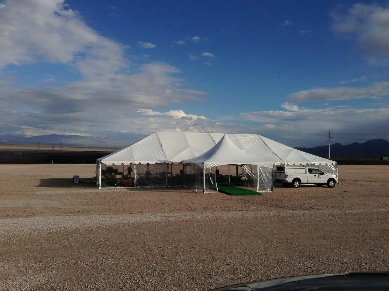 Modular event tent desert installation green turf interior for rent in Las Vegas