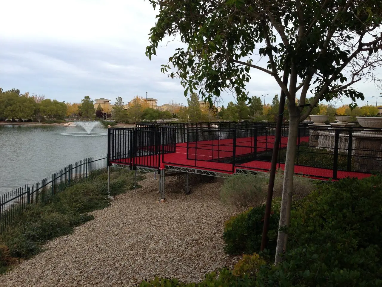Tent and red carpet platform installed over water on a lake