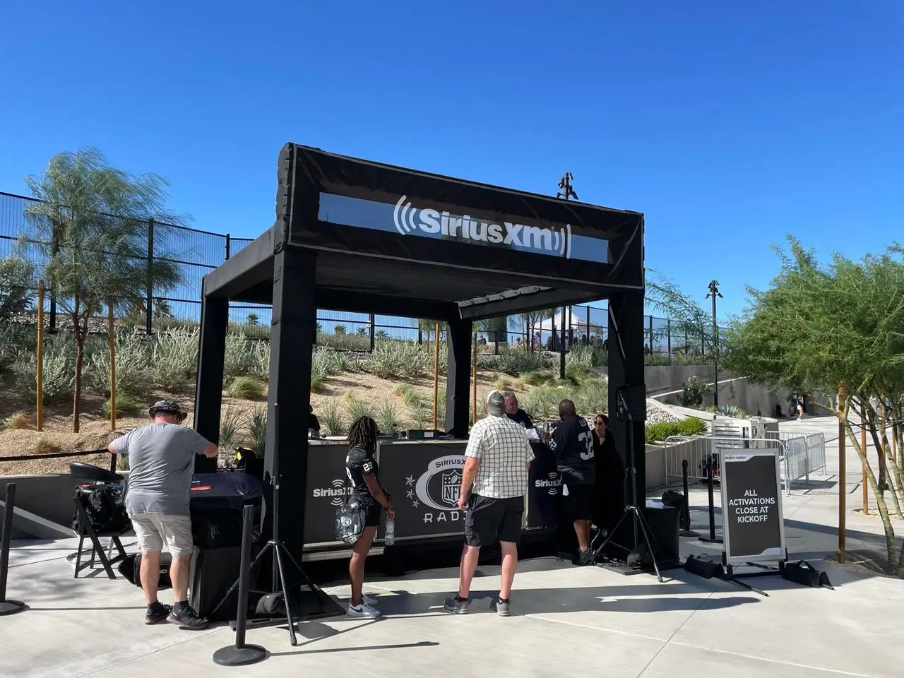 SiriusXM NFL Radio broadcasting booth tent at an outdoor event
