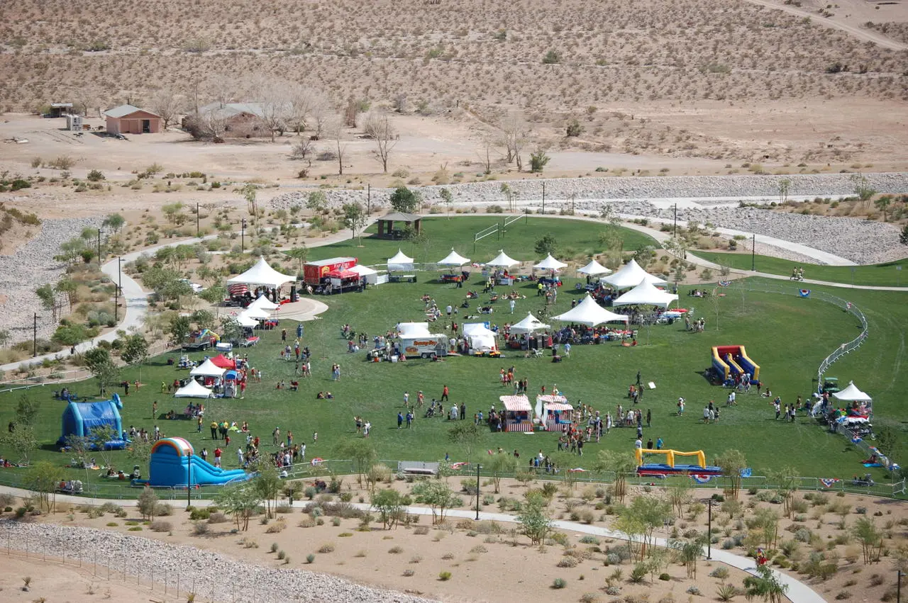 Aerial view of a festival with tents, inflatables and food trucks