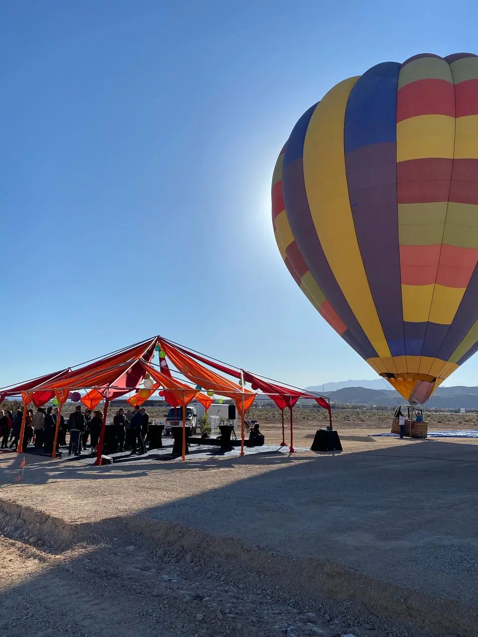 Hot air balloon outdoor corporate event tent desert mountain backdrop for rent in Las Vegas