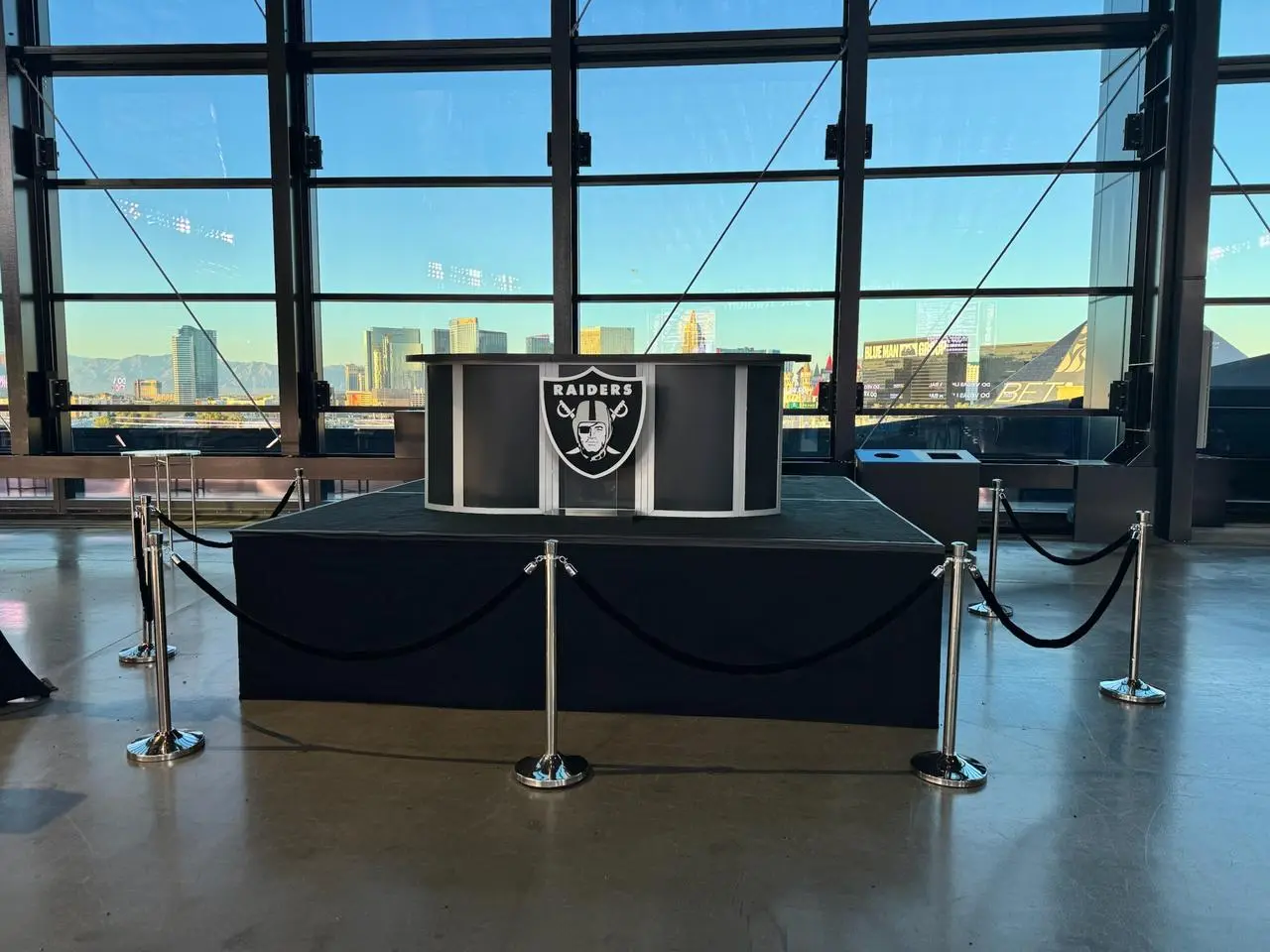 Las vegas raiders logo reception desk stadium lounge city skyline for rent in Las Vegas