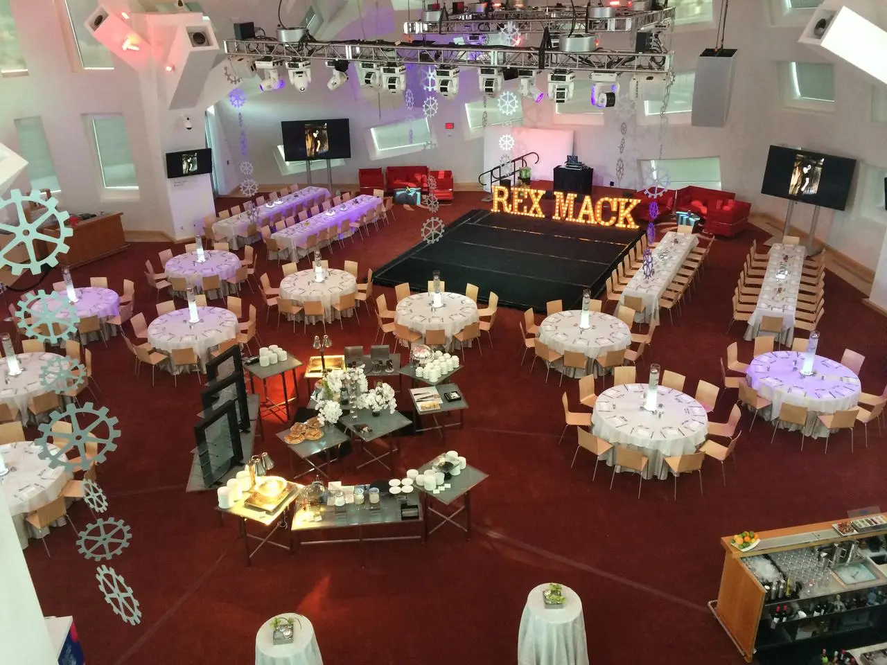 Rex mack corporate gala gear themed decorations white tables stage lighting for rent in Las Vegas