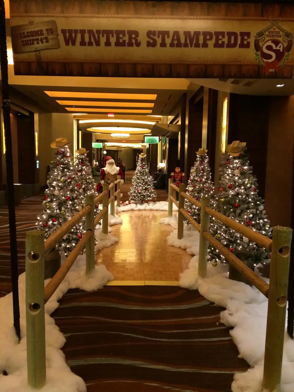 Shift4 winter stampede western themed christmas trees cowboy hats santa for rent in Las Vegas