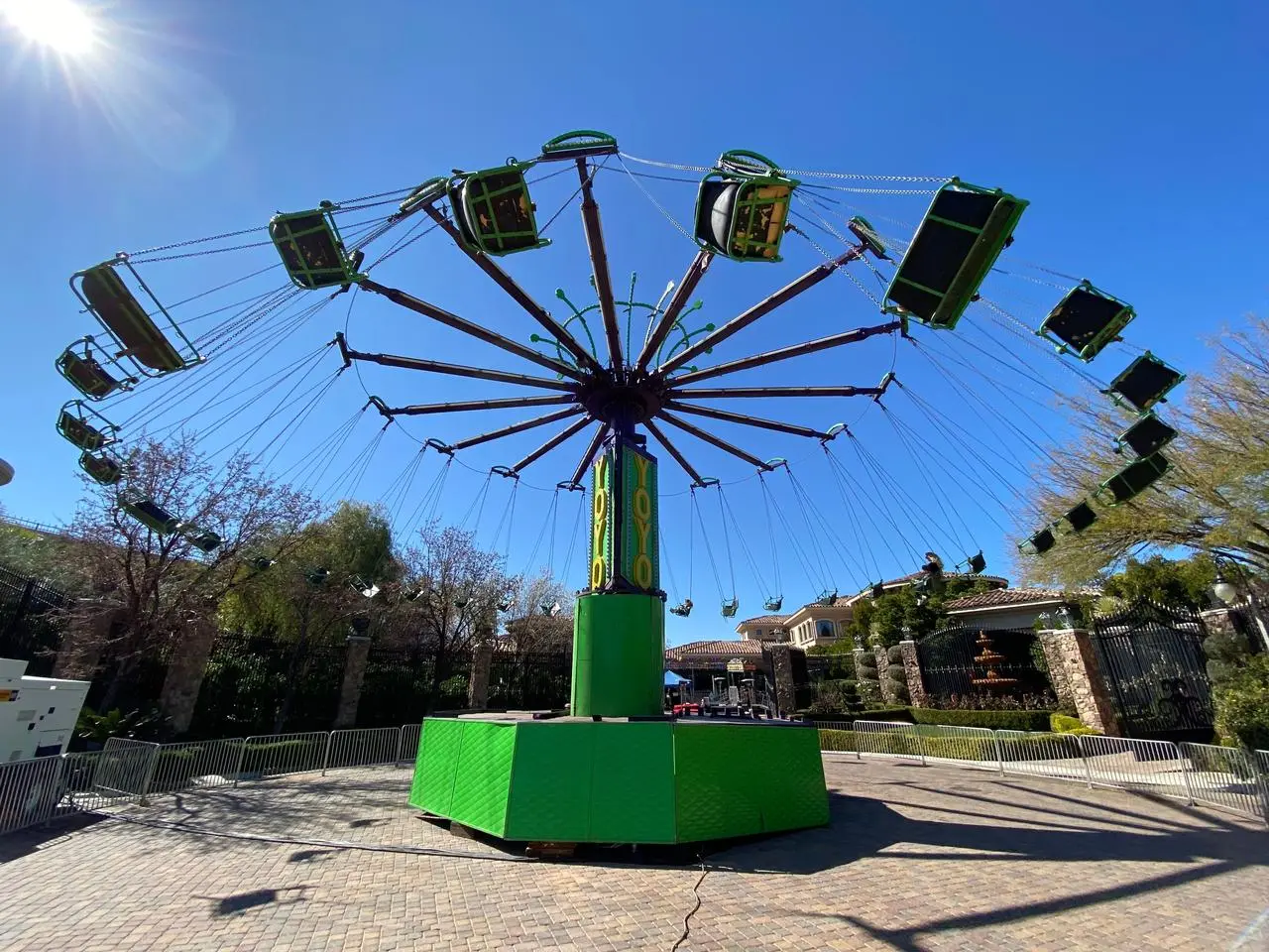 Yoyo swing ride green purple outdoor carnival residential background for rent in Las Vegas